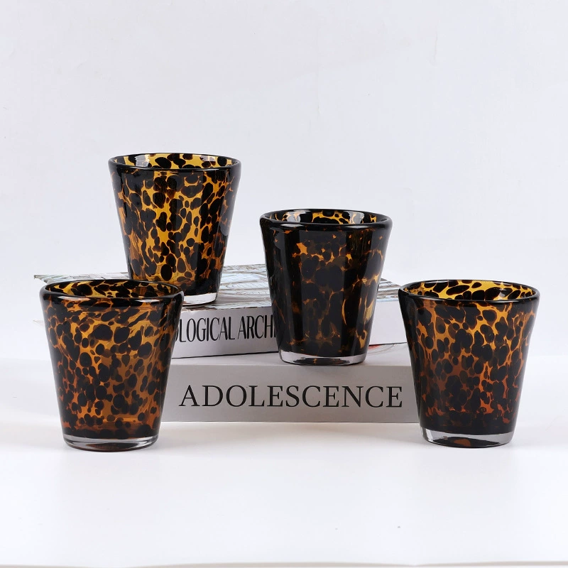 Handmade glass cu with tortoiseshell pattern for whiskey. Perfect for stylish drinking experiences.