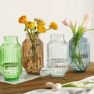Elegant handmade glass cu. vases with ribbed design, perfect for floral displays and home decor.