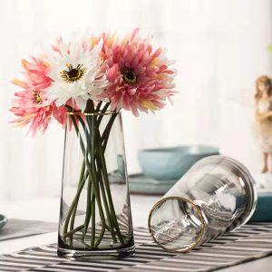 Elegant handmade glass vase with gold trim, perfect for floral arrangements.
