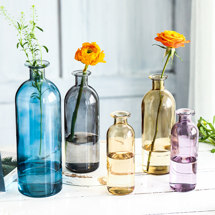 Handmade glass cups and vases from Zibo Bull Glassware Co., Ltd. featuring colorful, elegant designs.