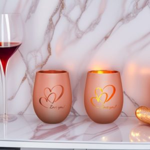 Handmade glass candle holders with heart design, perfect for romantic settings and home decor.