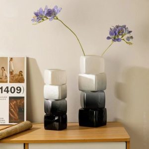 Handmade glass geometric vases with bamboo woven accents, perfect for modern home decor.